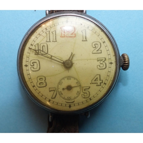 233 - A WWI silver-cased trench watch, with enamel dial and subsidiary dial, wire lugs, Swiss movement (wo... 