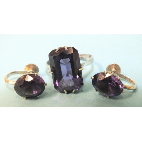 245 - A pair of synthetic purple sapphire earrings in white metal mounts, marked 9k and a similar ring, (a... 