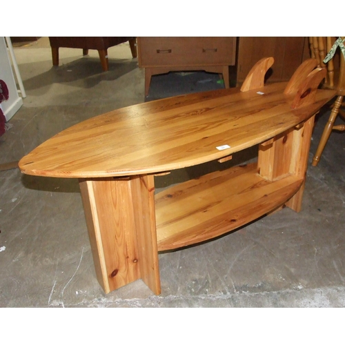 67 - A modern pine kitchen table with two drawers, on turned legs, a pine occasional table in the form of... 