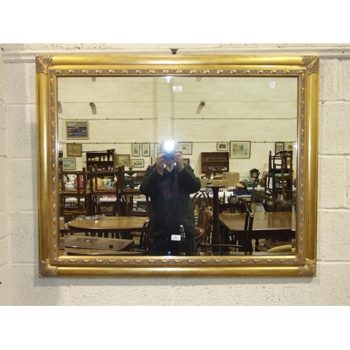 70 - A modern gilt frame bevelled wall mirror, 93 x 119cm.