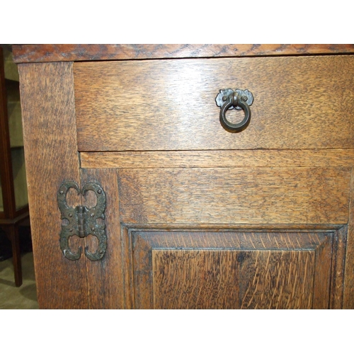 81 - An oak dresser base in the Arts and Crafts taste, having an arrangement of three drawers and three c... 