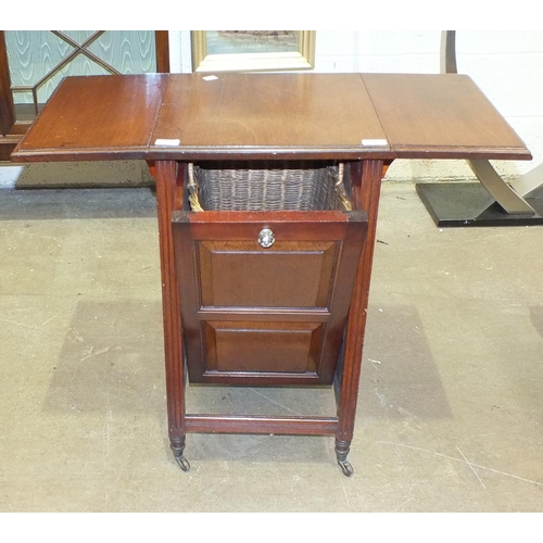 17 - A mahogany coal purdonium with panelled door, wicker lining basket and the top with folding leaves, ... 