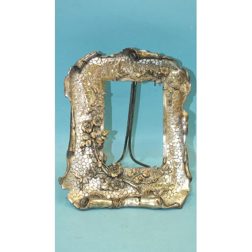 201 - An early-20th century plated metal photograph frame decorated with flowers and a butterfly, 26 x 20c... 