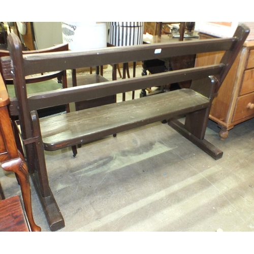 21 - A 20th century stained wood station bench, with moveable back rest to allow seating on either side, ... 