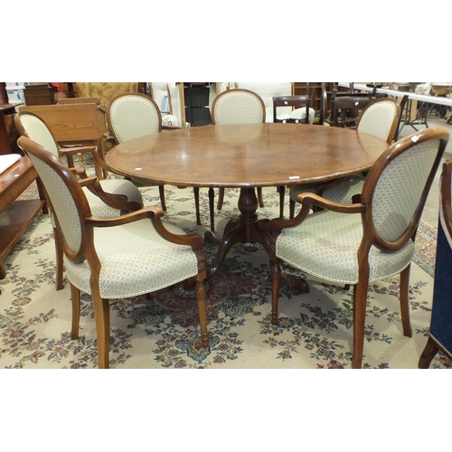 24 - A suite of high-quality reproduction burr walnut dining furniture, comprising a circular cross and f... 