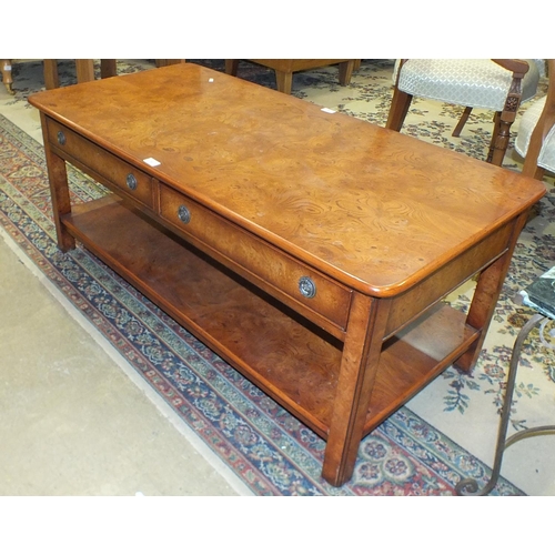 30 - A modern walnut two-tier coffee table fitted with two frieze drawers, 122 x 61cm, 50cm high.... 