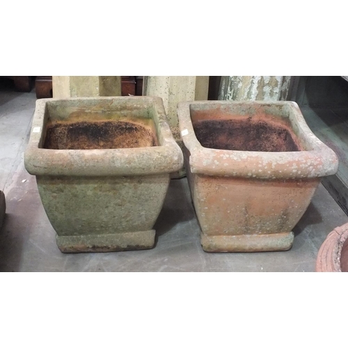 38 - A pair of terracotta-coloured pottery square-form planters, 44cm high, 47cm square, (2).... 