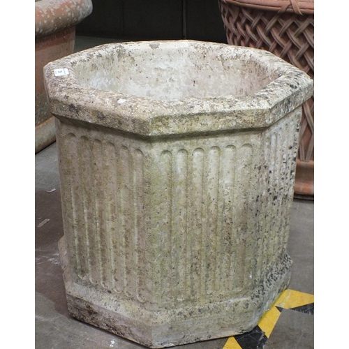39 - Three chimney pots, 90cm high, (damages) and an octagonal reconstituted stone planter, 42cm high, 45... 
