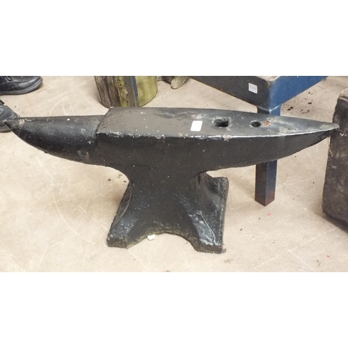 44 - A large iron anvil, 81cm wide, 30cm high, an iron pump and a vintage mechanical hoe, (3).... 