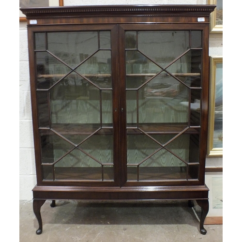 5 - A mahogany bookcase with dentil cornice above two astragal-glazed doors, on later stand, 110cm wide,... 