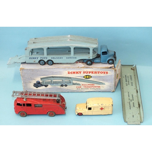 438 - Dinky Toys: 982 Pullmore Car Transporter with loading ramp, (boxed), 555 Fire Engine, (part of ladde... 