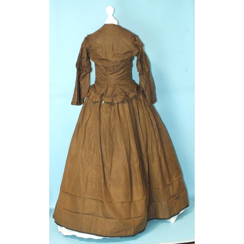 511 - A Victorian brown silk hand-stitched two-piece day dress c1860, the boned bodice with front opening,... 