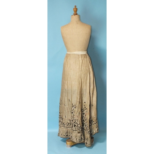 512 - A Victorian hand-stitched brown silk skirt, decorated with two flounces and taupe silk panels, a hea... 