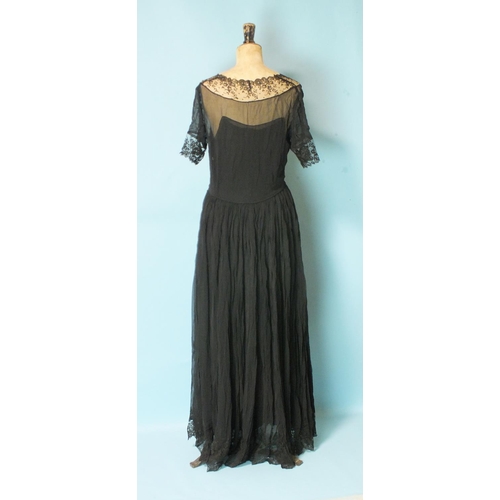 525 - A vintage black silk chiffon and lace evening dress with silk slip, size UK12 approximately, a black... 