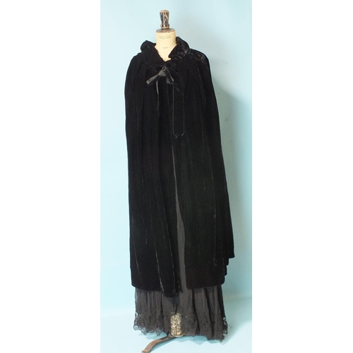 525 - A vintage black silk chiffon and lace evening dress with silk slip, size UK12 approximately, a black... 