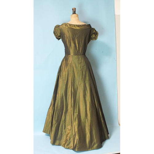 528 - A vintage sea-green taffeta evening gown with boat neck, ruched cap sleeves and seven-gored skirt, s... 