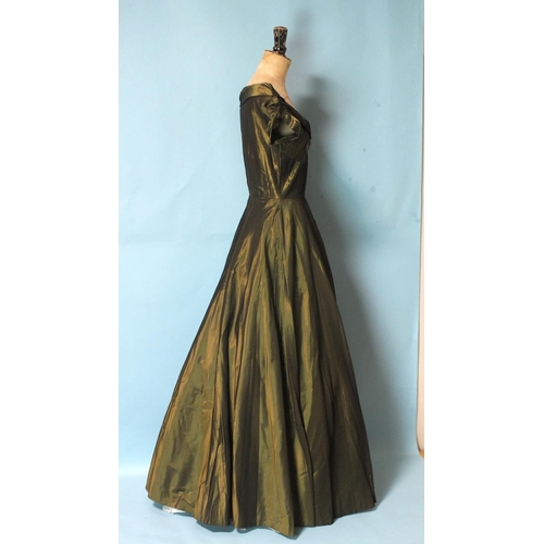 528 - A vintage sea-green taffeta evening gown with boat neck, ruched cap sleeves and seven-gored skirt, s... 