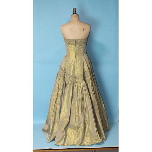 529 - Ricci Michaels, a 1950's lemon/old gold taffeta evening gown, the strapless boned bodice with ruched... 