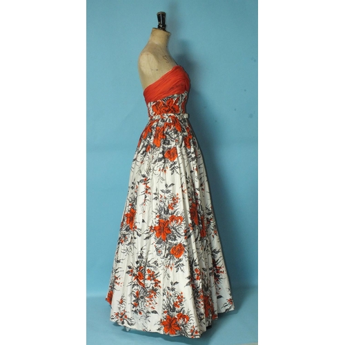 531 - Frank Usher, a 1950's floral cotton sateen evening dress with fitted boned bodice with red chiffon b... 