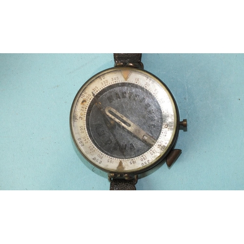 591 - A T.G. Co. Ltd military magnetic marching compass Mark I, no. B70039, together with a WWII Russian m... 