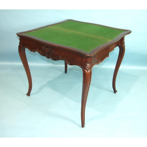 103 - A 19th century mahogany fold-over card table, the serpentine top with carved frieze and carved cabri... 