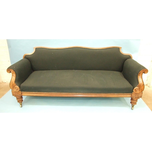 104 - LOT WITHDRAWNAn early-19th century campaign sofa, the shaped back and scroll arms on reeded and carv... 