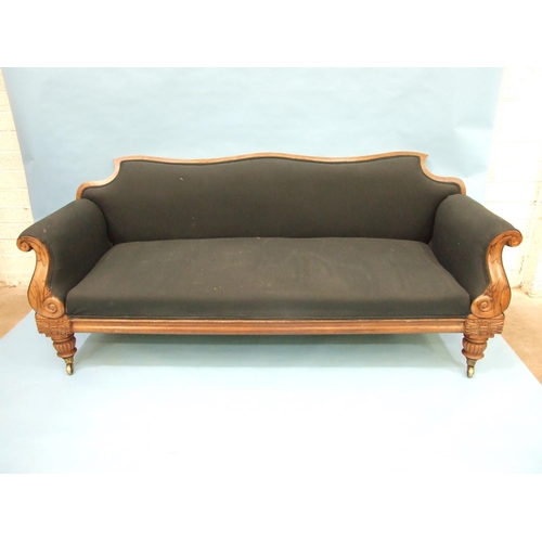 104 - LOT WITHDRAWNAn early-19th century campaign sofa, the shaped back and scroll arms on reeded and carv... 