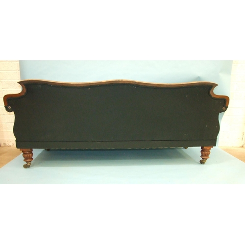 104 - LOT WITHDRAWNAn early-19th century campaign sofa, the shaped back and scroll arms on reeded and carv... 