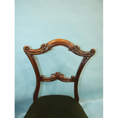 106 - A set of four Victorian rosewood dining chairs, each with carved and foliate back and  cabriole fron... 