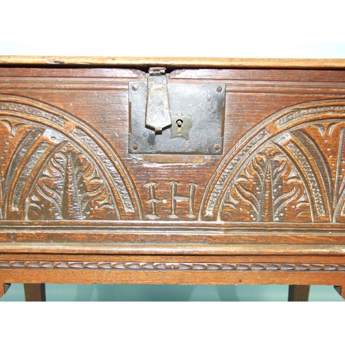 109 - An antique carved oak bible box on later stand, 76cm wide, 72cm high.