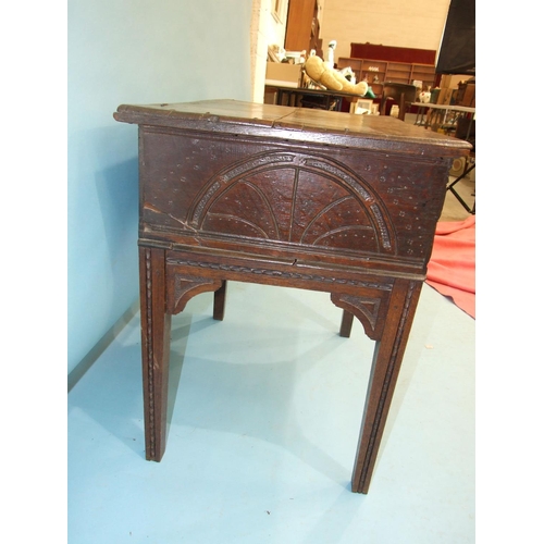 109 - An antique carved oak bible box on later stand, 76cm wide, 72cm high.