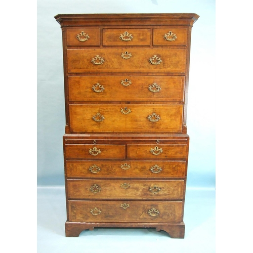 111 - A George II walnut chest on chest, the cornice above three small and three long feather-banded drawe... 