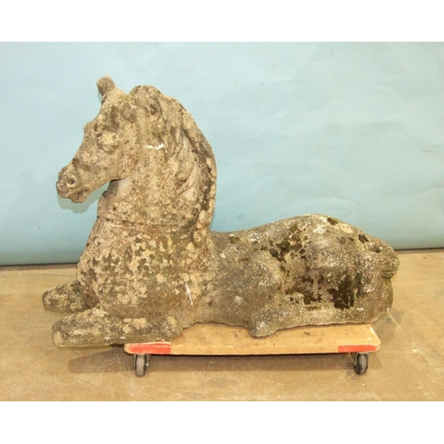 126 - A cast concrete model of a recumbent unicorn, horn and one ear missing, 85cm long, 60cm high.... 