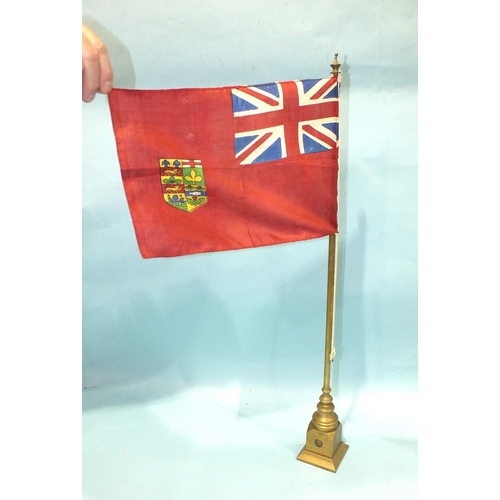 155 - An early-20th century brass conference table flag pole with flag, 62cm high, stamped beneath Eneret?... 