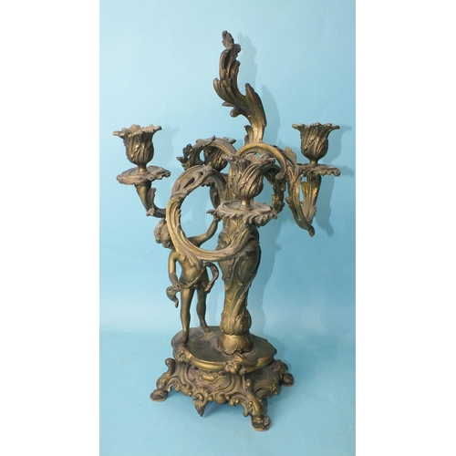 157 - A late-19th century bronzed metal and cut-glass epergne supported by a vase column and putti, on Roc... 