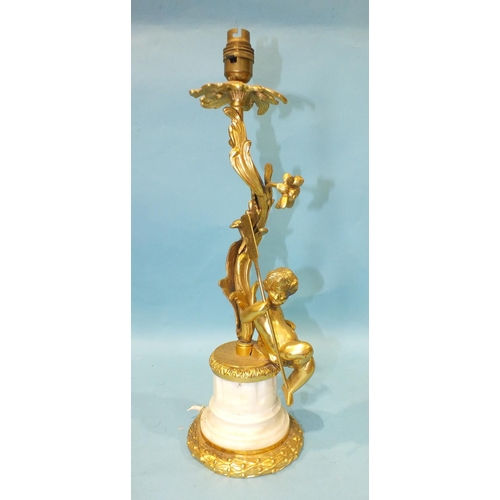 168 - A 20th century gilt brass and marble table lamp of foliate form, with a cherub seated on the fl... 