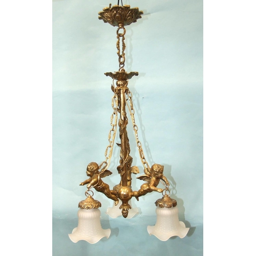 180 - A lacquered brass chandelier, the three branches modelled as winged cherubs from which are suspended... 