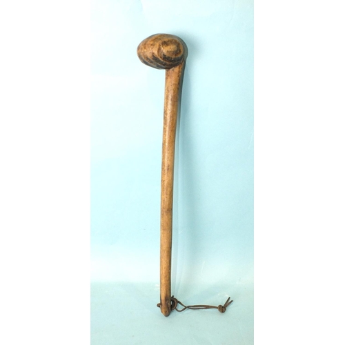 184 - A Kenyan tribal war club with swirl-carved knob, 54cm long, (bleached).