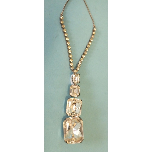 277 - A 20th century necklace of four graduated rectangular cushion-cut white pastes with foiled backs on ... 