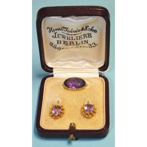 283 - A pair of Victorian amethyst earrings, 1.7cm long, the hook fitting with cannetile mounts, cased wit... 