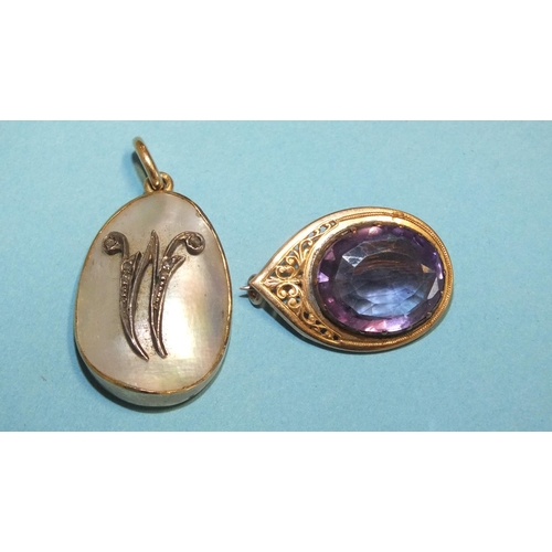 287 - A brooch of teardrop shape, with pierced decoration set oval amethyst and a gold and mother-of-pearl... 