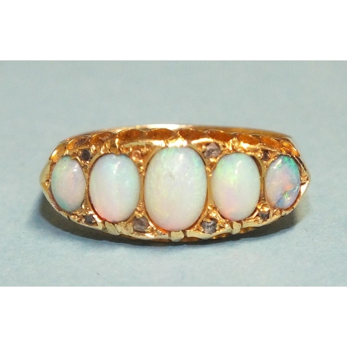 297 - A Victorian five-stone opal ring, the graduated oval opals with diamond points, in 18ct gold mount, ... 