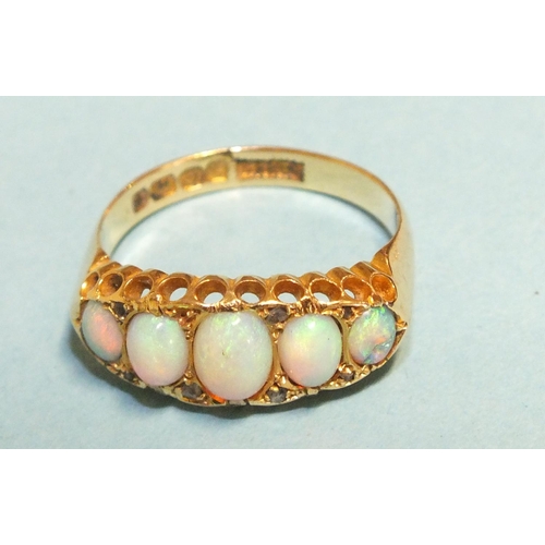 297 - A Victorian five-stone opal ring, the graduated oval opals with diamond points, in 18ct gold mount, ... 