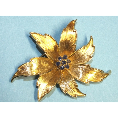 305 - A 1960's 18ct gold brooch of floral form, centrally-set a cluster of seven round-cut sapphires, make... 