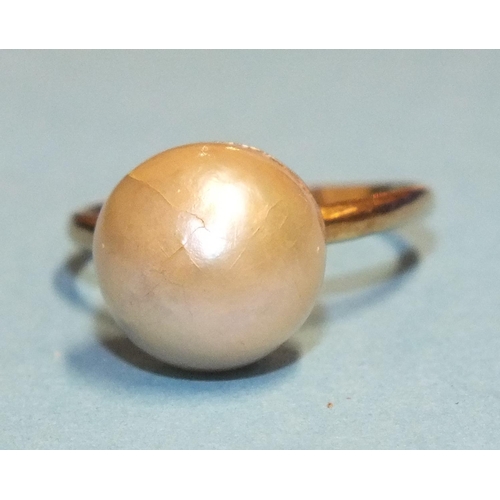 306 - A cultured pearl ring, the 9mm pearl, (cracked), on plain gold shank, (tests as 18ct approximately),... 