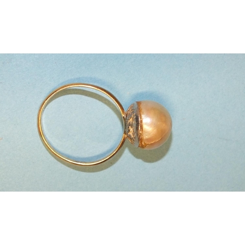 306 - A cultured pearl ring, the 9mm pearl, (cracked), on plain gold shank, (tests as 18ct approximately),... 