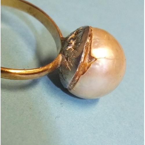 306 - A cultured pearl ring, the 9mm pearl, (cracked), on plain gold shank, (tests as 18ct approximately),... 