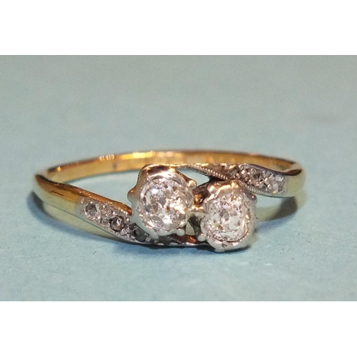 315 - A diamond cross-over ring set two old brilliant-cut diamonds, between diamond-set shoulders, the sha... 