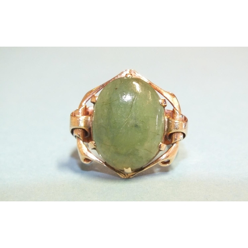 326 - A jade ring claw-set green jade cabochon, in rose gold mount, marked '15k', size L, 7.8g.... 