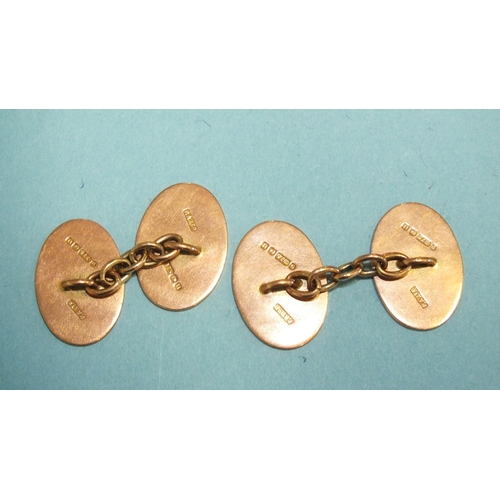 328 - A pair of 9ct rose gold plain oval cufflinks, 8.7g, (boxed).